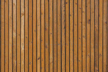 Detail fasádního obkladu KI Trend v okrové barvě. Královská impregnace zaručuje efektivní ochranu dřeva v exteriéru. Detail fasádního obkladu KI Trend v okrové barvě. Královská impregnace zaručuje efektivní ochranu dřeva v exteriéru.